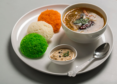concept of indian independence day with food - tri colored idli with sambhar and conconut chutney
