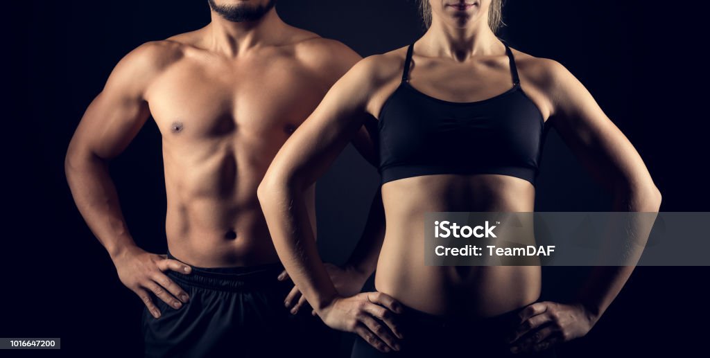 Perfectamente en forma de cuerpos femeninos y masculinos superiores - Foto de stock de Cuerpo humano libre de derechos