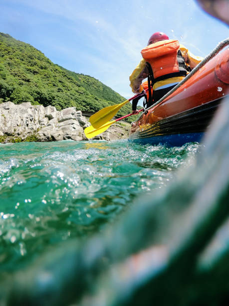 istock Low angle view of a white water river rafting excursion 1016650358