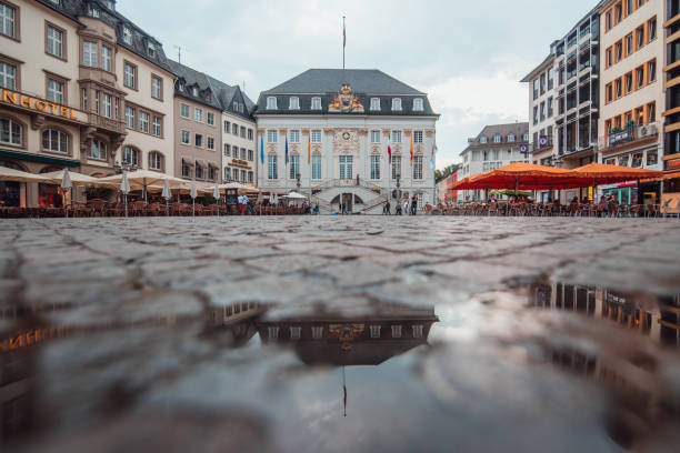 Bonn, Germany Markt Square in Bonn, Germany, and reflection on a puddle bonn germany stock pictures, royalty-free photos & images
