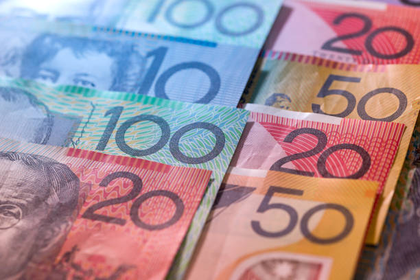 istock Banknotes of australian dollars in rows as background 1016651636