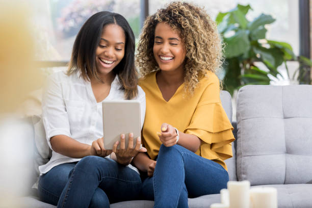 istock Female friends looking at digital tablet 1016654610