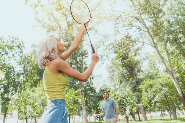 istock couple playing badminton outdoors in summer 1016658794