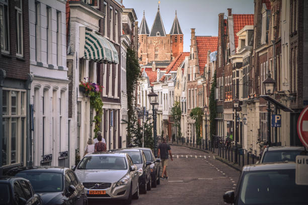 Haarlem, Netherlands - August 05.2018: Cars parked in a narrow street of Haarlem.