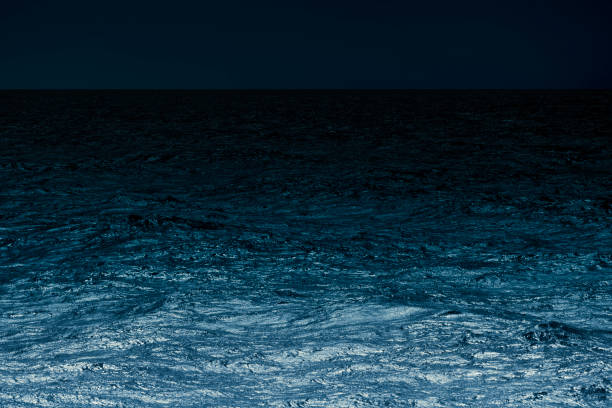 Sea surface under blue moonlight of the deep sea with copy space.