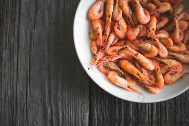 istock on a white plate on wooden background shrimp 1016681050