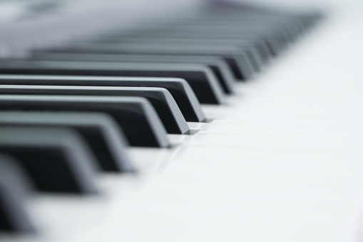 Piano is a musical instrument classified as a percussion instrument that is played by pressing keys on a keyboard.