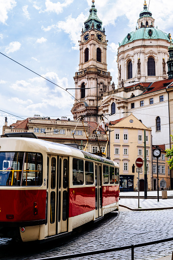 A street photography of a tram moving in Mala Strana district, the oldest district in Prague.