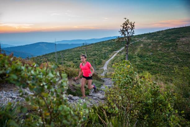 istock Woman trail running in mountains. 1016682028