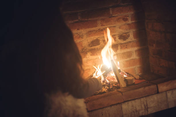 istock Young girl checking fireplace 1016684498