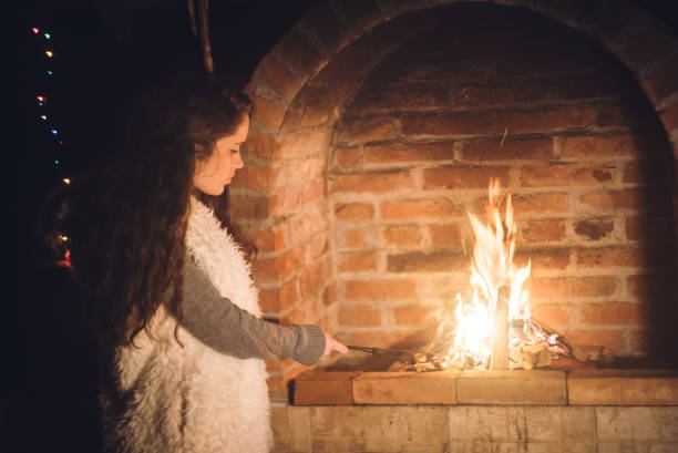 istock Young girl checking fireplace 1016685186