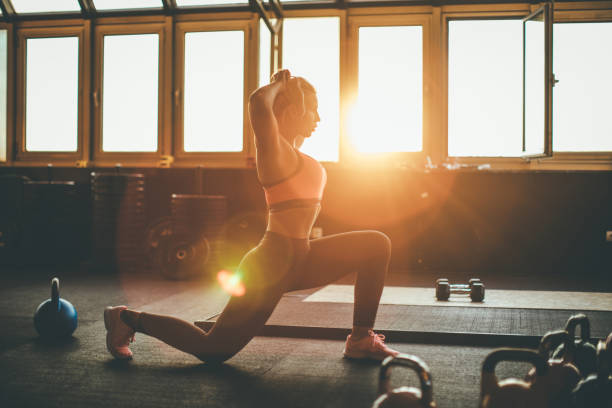 istock Woman stratching at the gym 1016685402