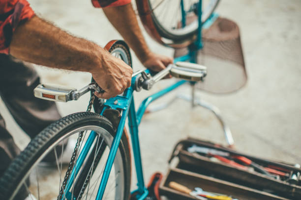 istock Mature man repairing bike 1016689028