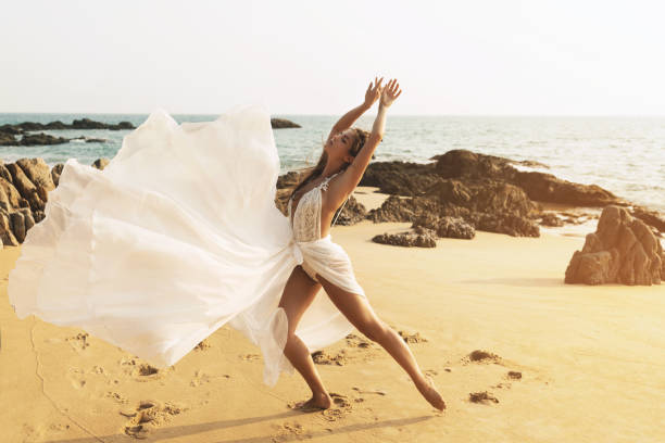 istock Young and beautiful bride on the beach 1016697450