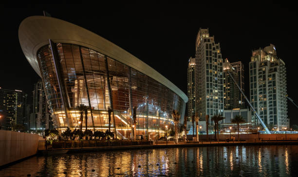 DUBAI, UAE, MAR 19, 2018: The Opera Building in Dubai sits on the marina edge
