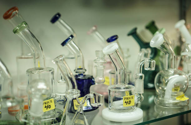 Cannabis Smoking Bongs In Shop Bongs on display in a dispensary. bong photos stock pictures, royalty-free photos & images