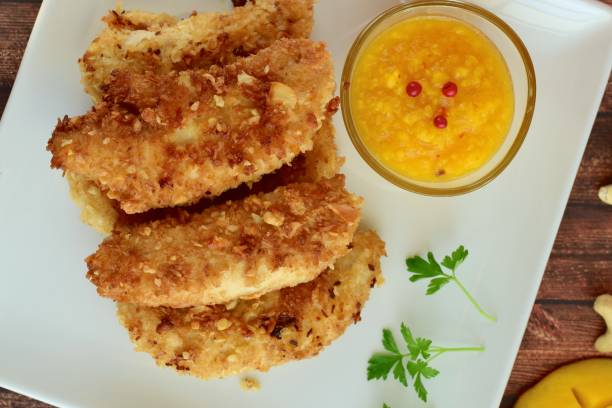 istock Coconut cashew chicken fingers with mango sauce 1016707352