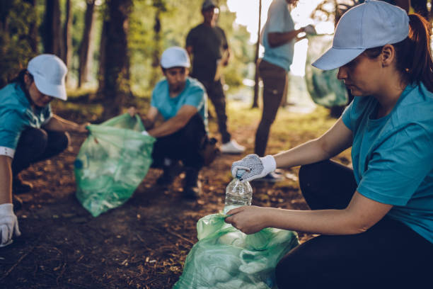 istock Volunteers cleaning park 1016707406