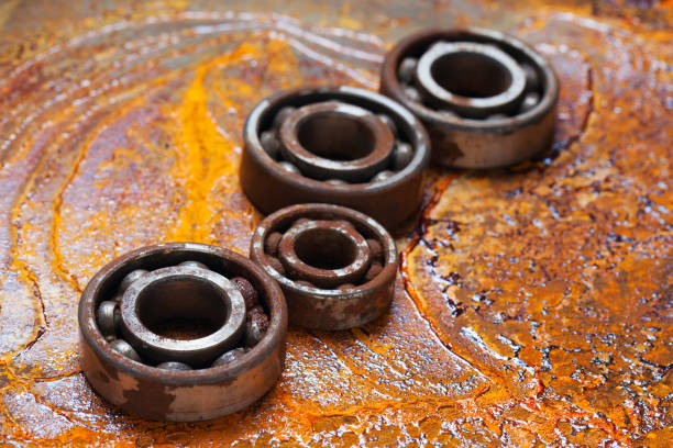 Rusty ball bearing with the rusty background. stock photo