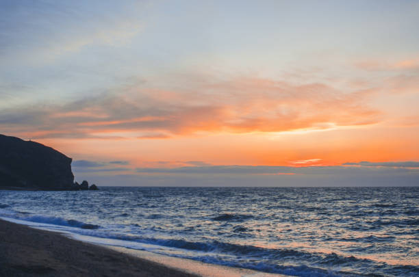 istock Photo frame stone, sea at sunset place for lettering, copy space 1016715412