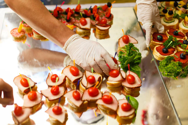 istock The waiter puts desserts on a buffet table 1016715444