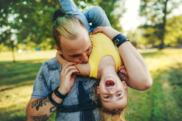 istock Son is upside down in his daddy's arms 1016720448