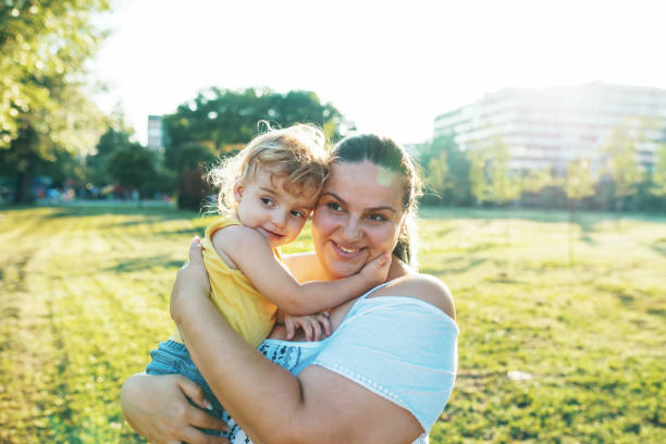 istock Young mother and her son in the park 1016720846