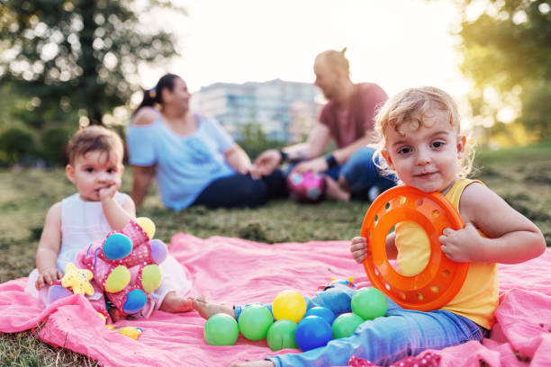 istock Siblings in park with parents 1016722922