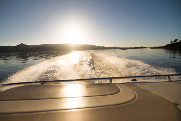 istock Water trail from motorboat in sunlight 1016728812