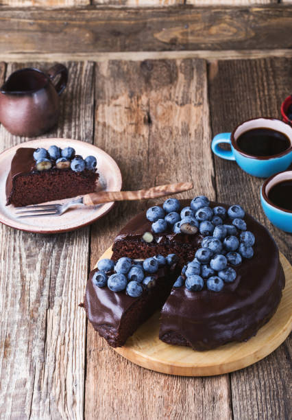 istock Chocolate cake topped with chocolate glaze and fresh blueberries 1016740064