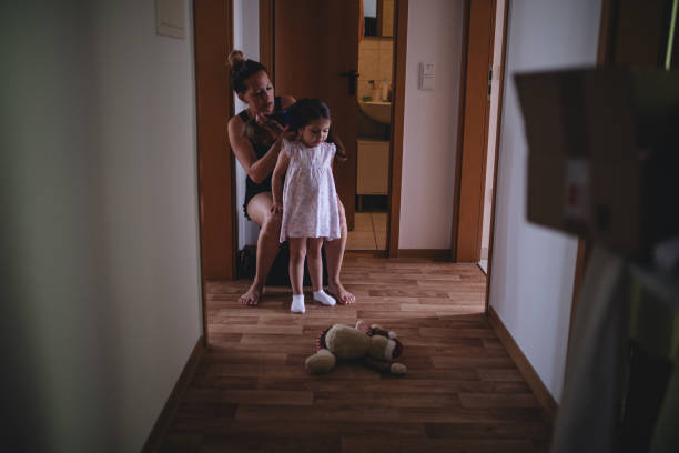 istock Mother and daughter preparing to go out 1016740158