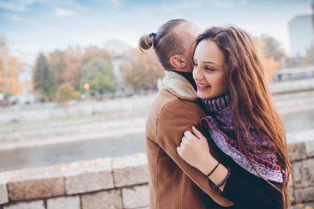 istock Couple hugging passionately by the river 1016743736