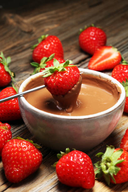 istock Fondue with Melting chocolate or melted chocolate and strawberry. 1016753838