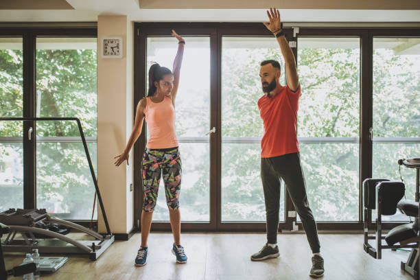 istock Couple training together at a gym 1016758490