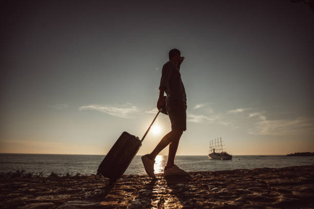 istock Tourist walking by the sea 1016761472