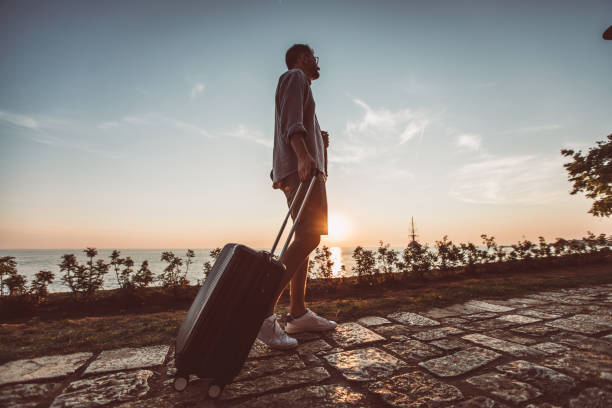 istock Man walking by the sea 1016761534