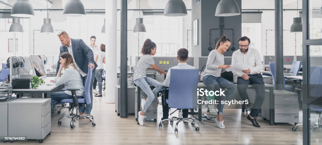 Team at work concept. Team at work. Group of young business people working together in creative modern office. Office Stock Photo