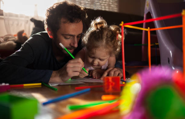istock Father playing with daughter indoors 1016772008