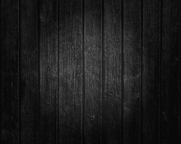 istock Black wooden boards texture background with lighting 1016772368