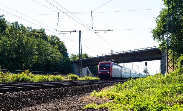 istock A moving railway train under the viaduct on a summer sunny day in western Germany. 1016777284
