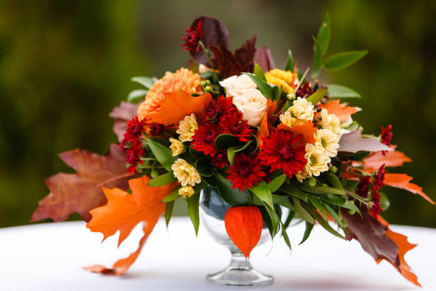 istock autumn flower composition with roses, chrysanthemum and maple leaves 1016777312