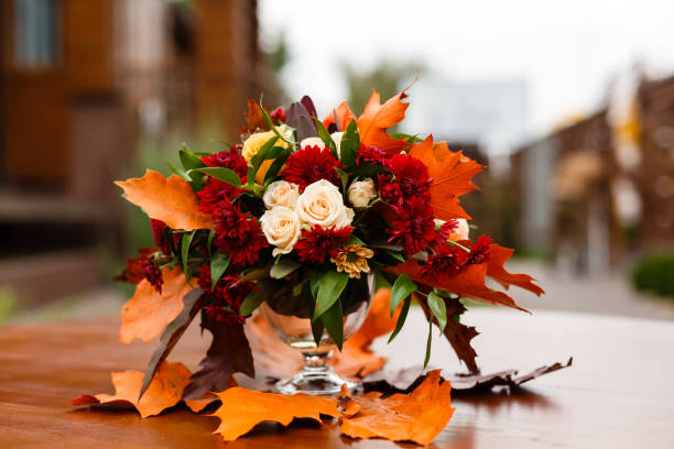 istock autumn flower composition with roses, chrysanthemum and maple leaves 1016779022