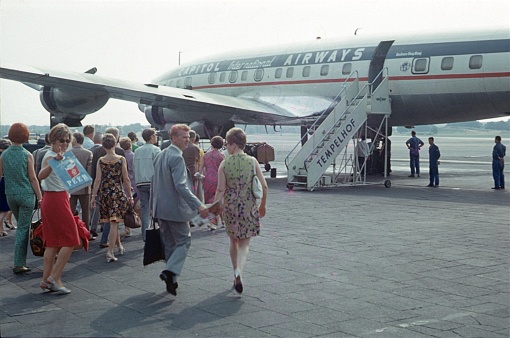 Berlin (West), Germany, 1966. Boarding at the former Tempelhof Airport. Passengers board an airplane on the Tempelhof airfield.