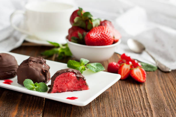 istock Strawberry ice cream balls in chocolate 1016783180
