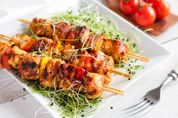 istock Mediterranean grilled chicken skewers served with microgreen and cherry tomatoes 1016783390