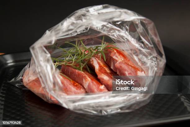 Cooking Baking Plastic Bag No Pastic Concept Fresh Pork Meat Steake Packaged In A Sleeve With Spices For Baking Is Ready For Baking Isolated On Black Background Top View Stock Photo - Download Image Now