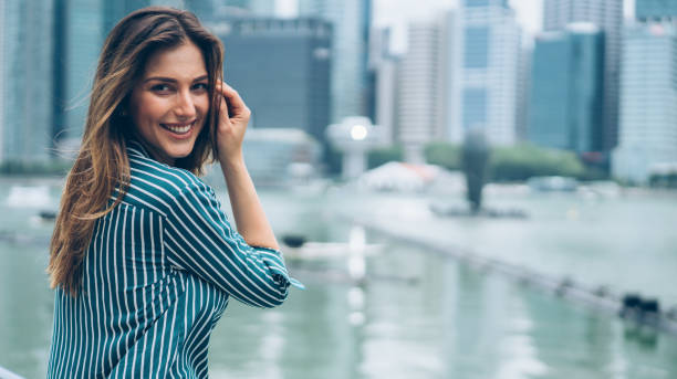 istock Smiling young woman in Singapore 1016793778