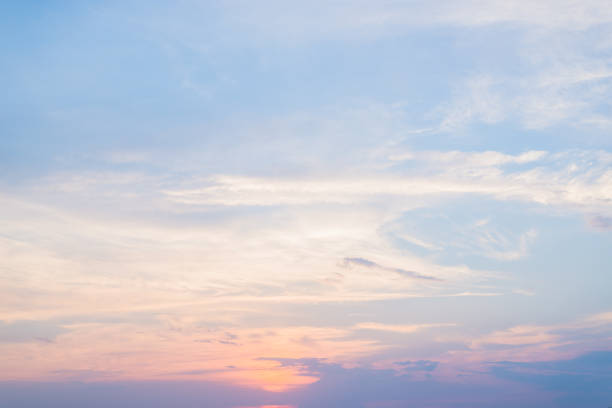 istock Stunning clouds and orange sunset in the bright sky 1016796288