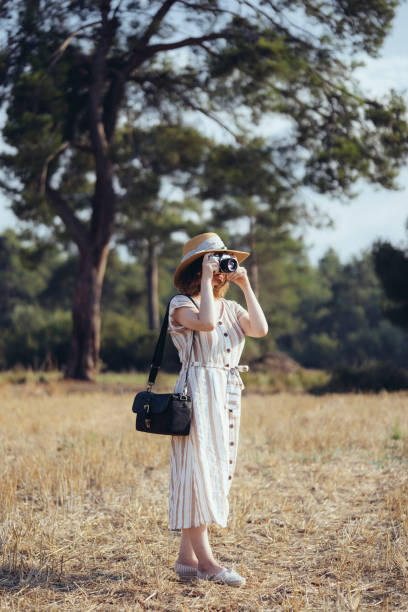 istock Young woman taking a picture 1016800894