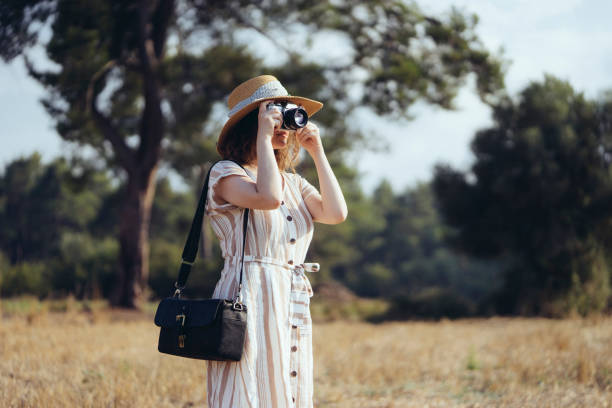 istock Young woman taking a picture 1016800898